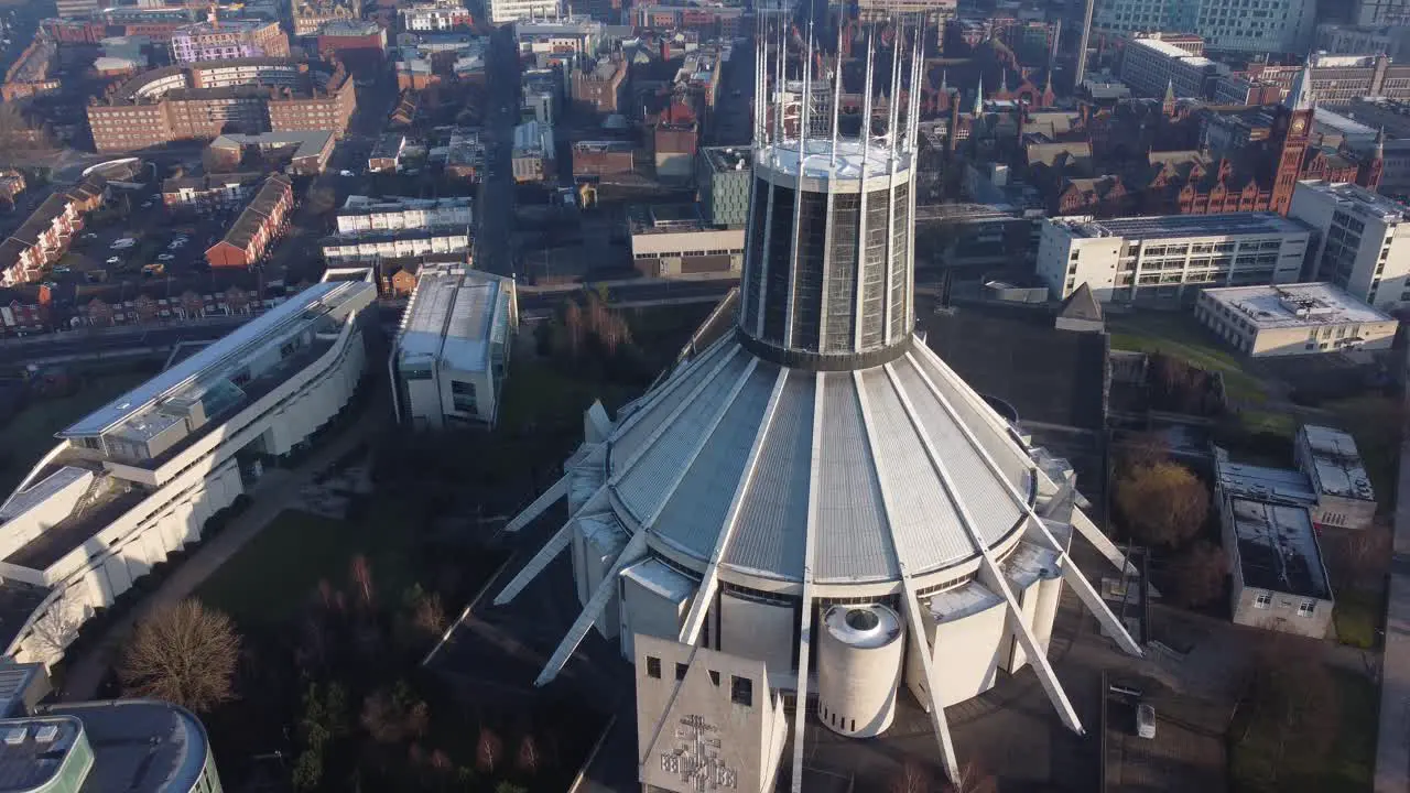 Liverpool Metropolitan cathedral contemporary city famous rooftop spires aerial tilt down birdseye