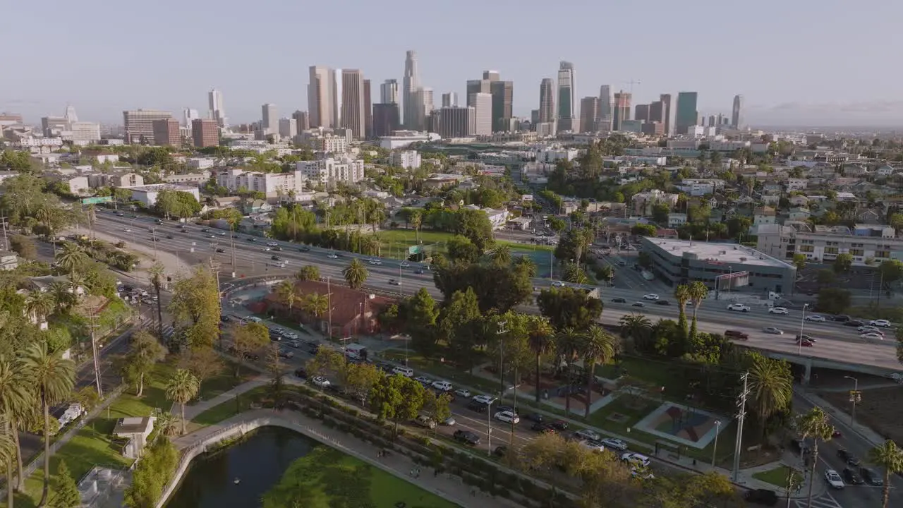 Drone Flying Over Downtown Los Angeles on a Sunny Day Echo Park Lake and City Skyline in View