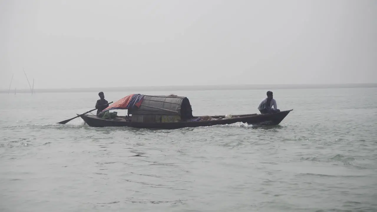 Motor-driven small boat is moving ahead through the river water