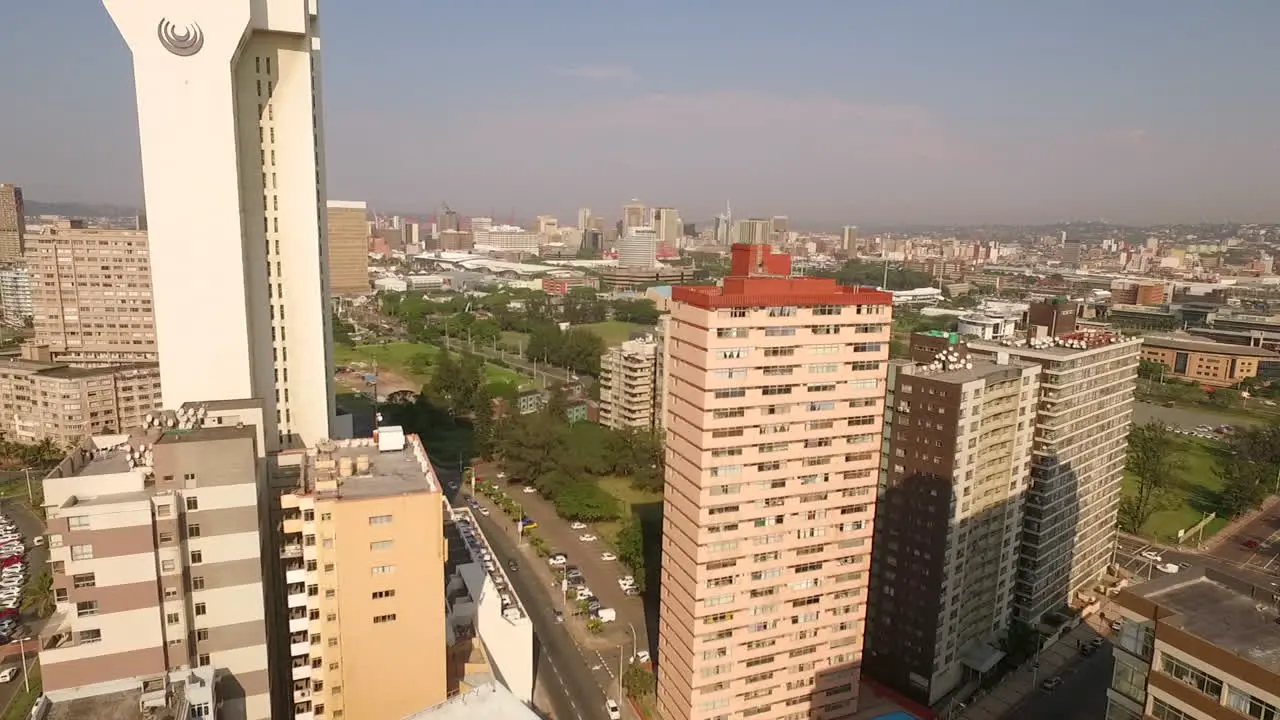 Aerial drone shot through Durban City Centre with the Southern sun Hotel