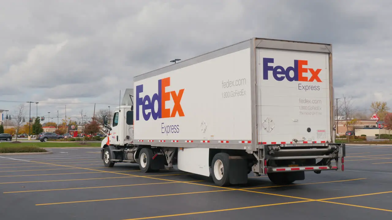 Lockport NY USA October 2021 A Fedex truck is parked in a supermarket parking lot