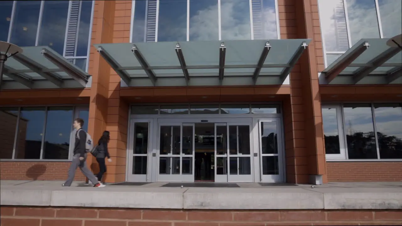 People Going In And Out Of a Building on NC State's Campus In Raleigh City In The American State Of North Carolina