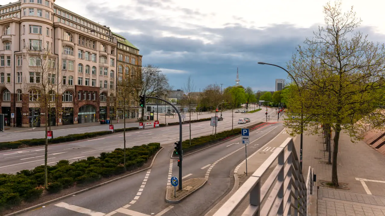 Moving time lapse of beautiful historic building of Kunsthalle with huge intersection traffic and Heinrich Hertz Tower in Hamburg Germany