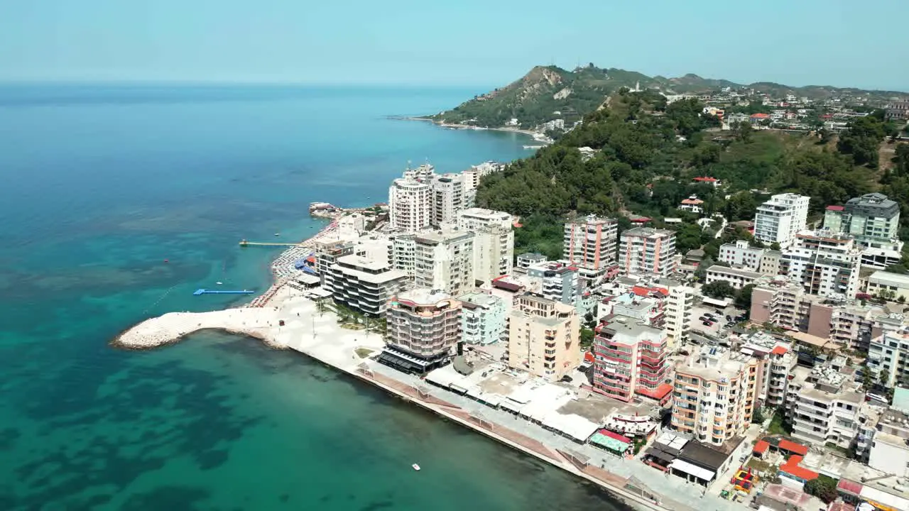 Durres promenade city buildings and Adriatic Sea beach aerial view from a drone