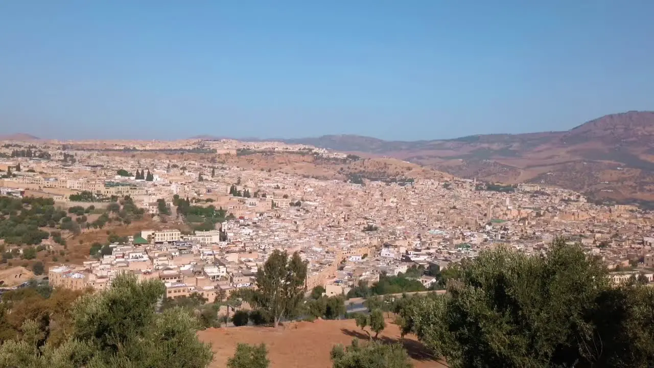 Morocco Fes view of the country's cultural capital city from distance during daylight with clear blue sky