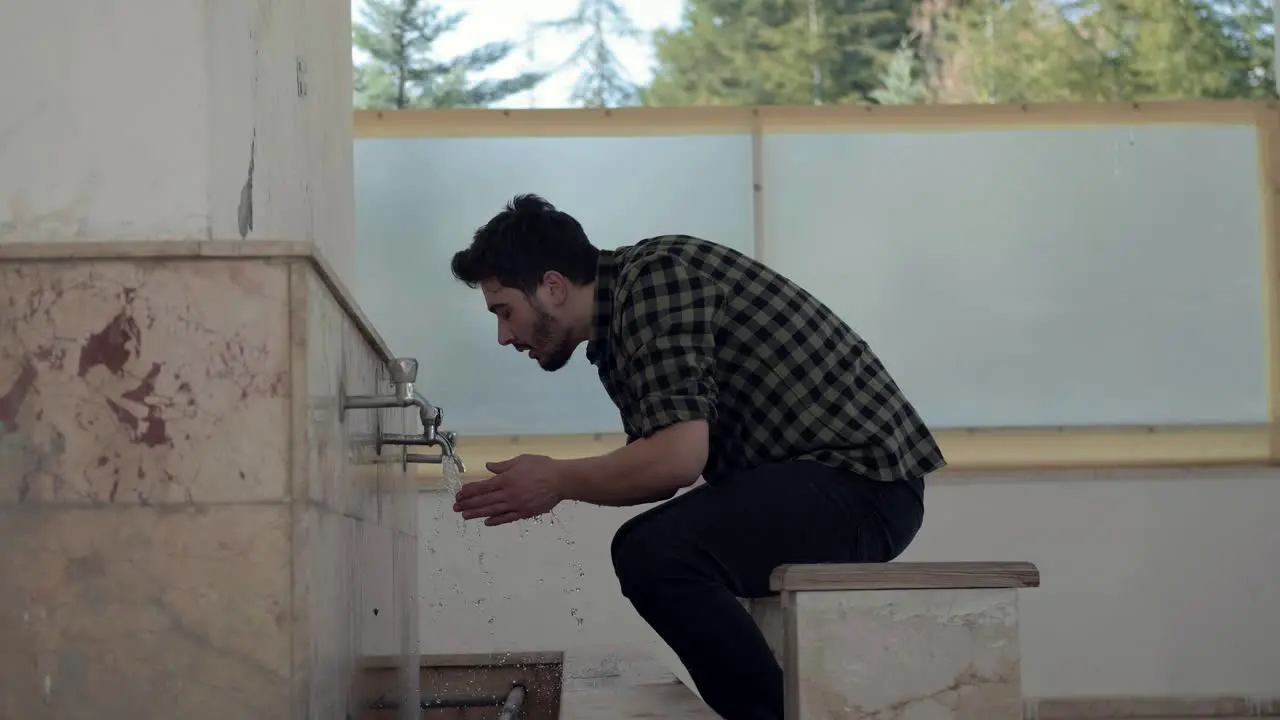 Young Muslim Man Taking Ablution For Prayer In Mosque 3