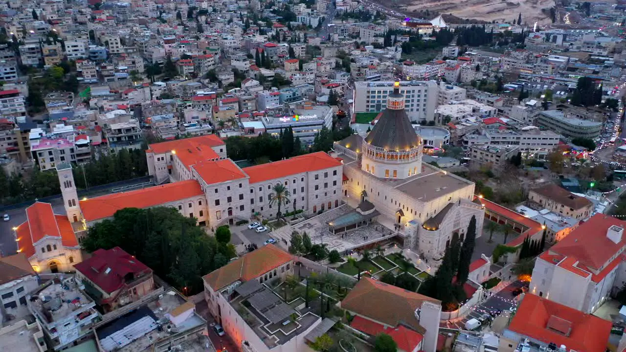 Aerial footage of the Basilica of the Annunciation over the old city houses of Nazareth