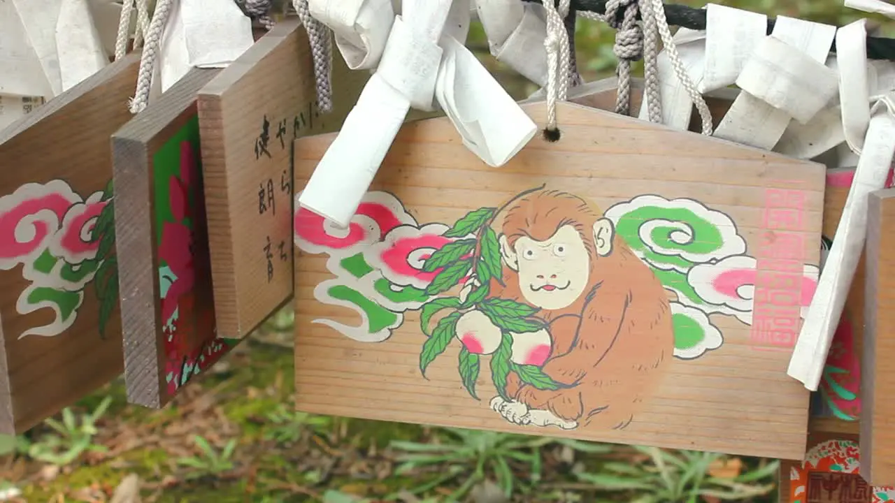 Wooden plate with drawing of a monkey in Shinto Shrine