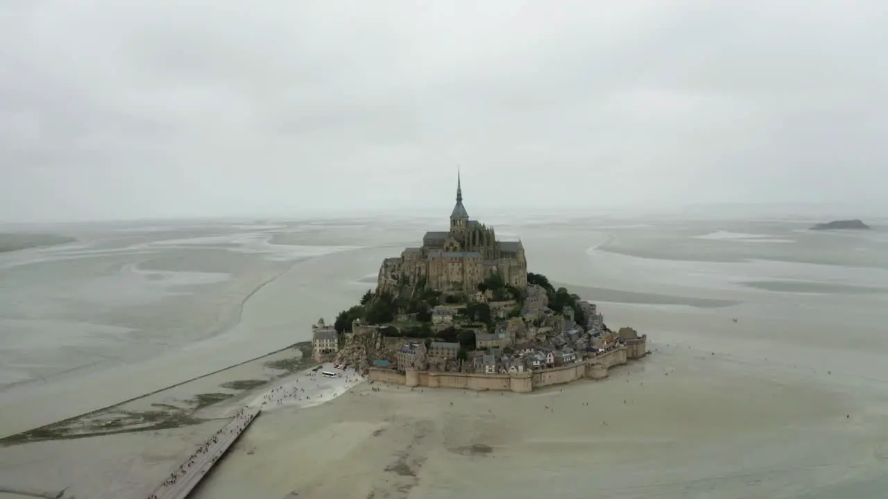 mont saint michel drone camera going forward there are many toristo coming to see the palace