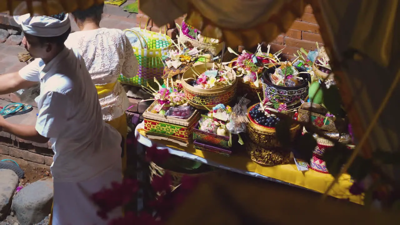 Balinese man and woman perform the ceremony for the lunar moon celebration