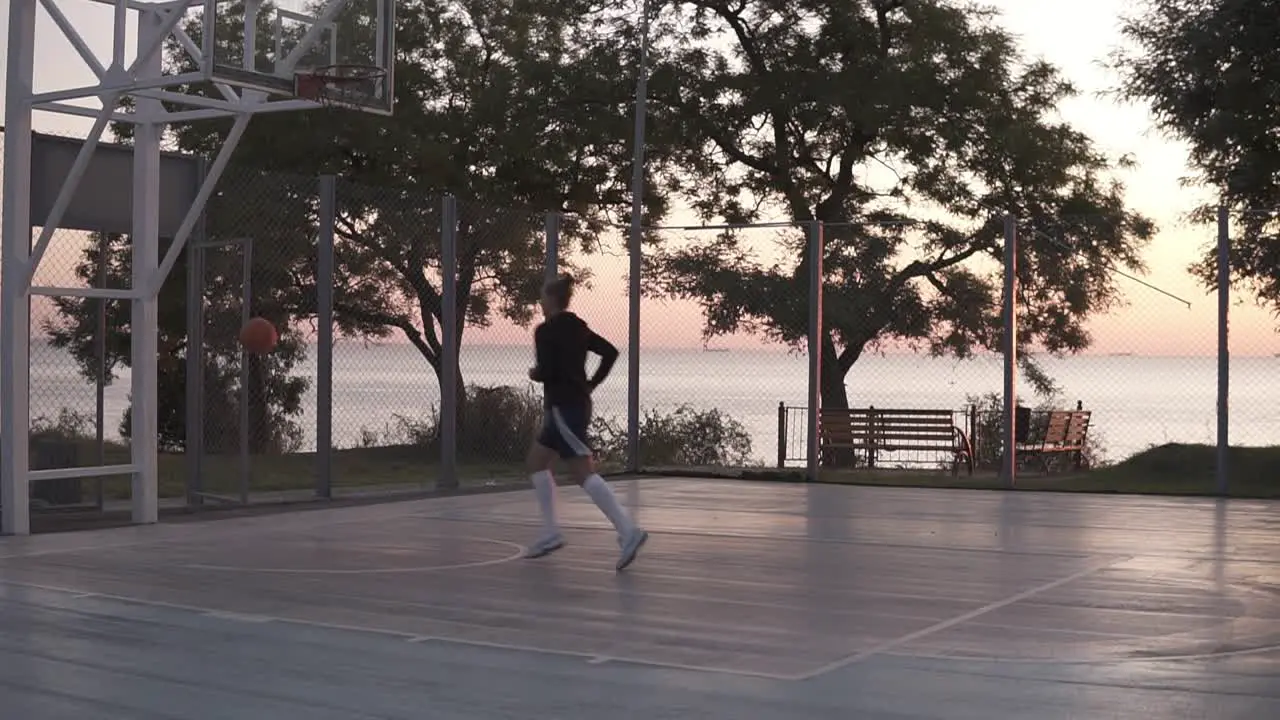 Handhelded Footage Of Young Girl In Shorts And White Golf Socks Make A Shot To The Basketball Net 1