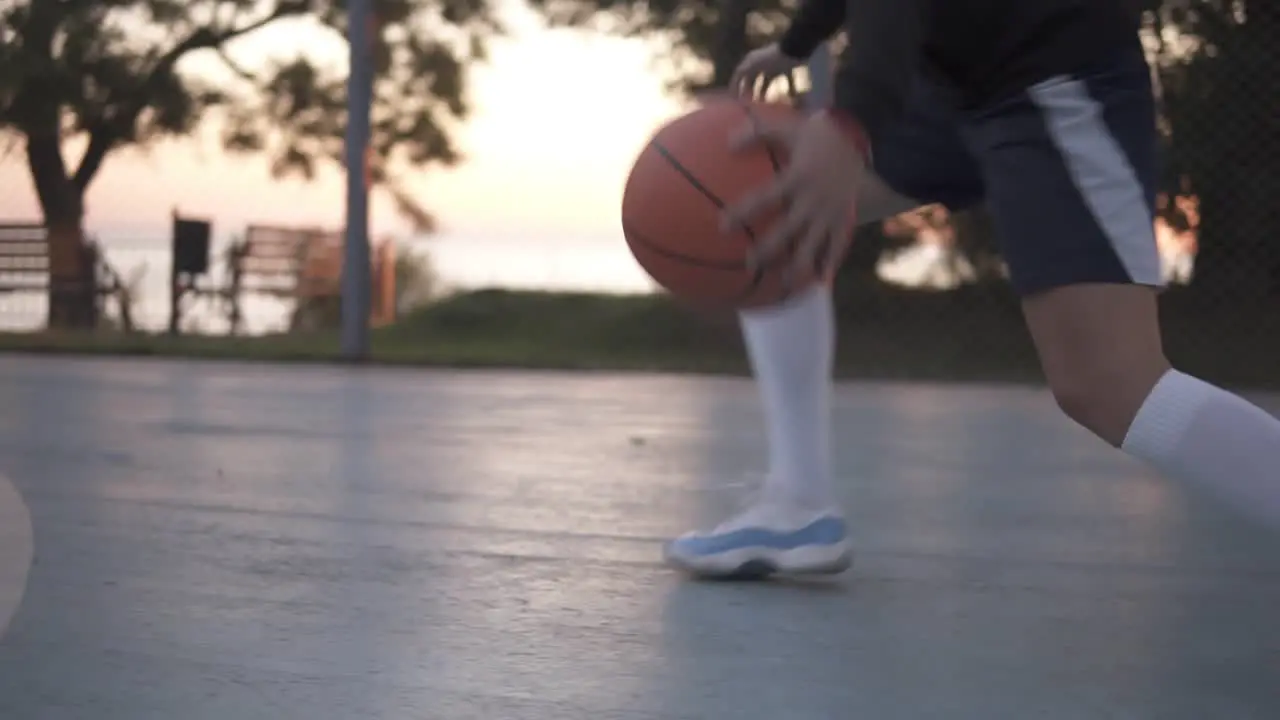 Close Up Footage Of A Young Girl Basketball Player Training And Exercising Outdoors On The Local Court 1