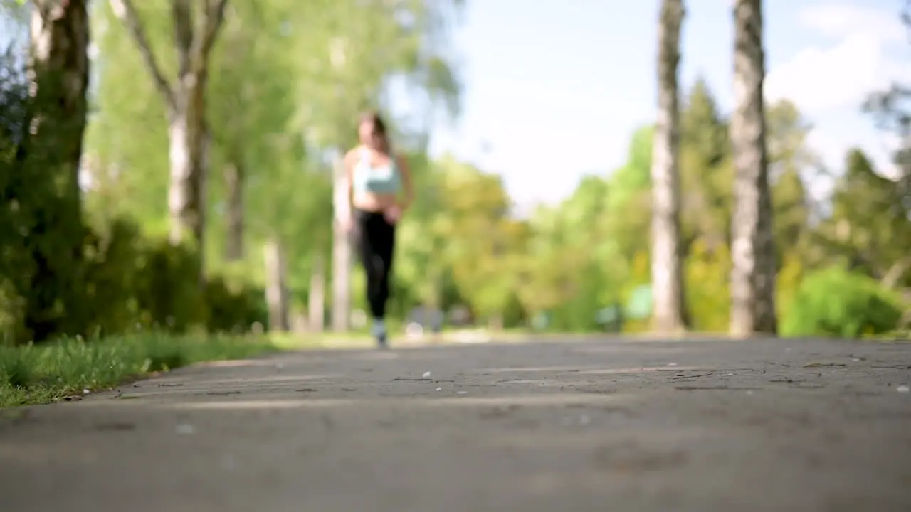 Sportswoman Running At The Park In A Sunny Day