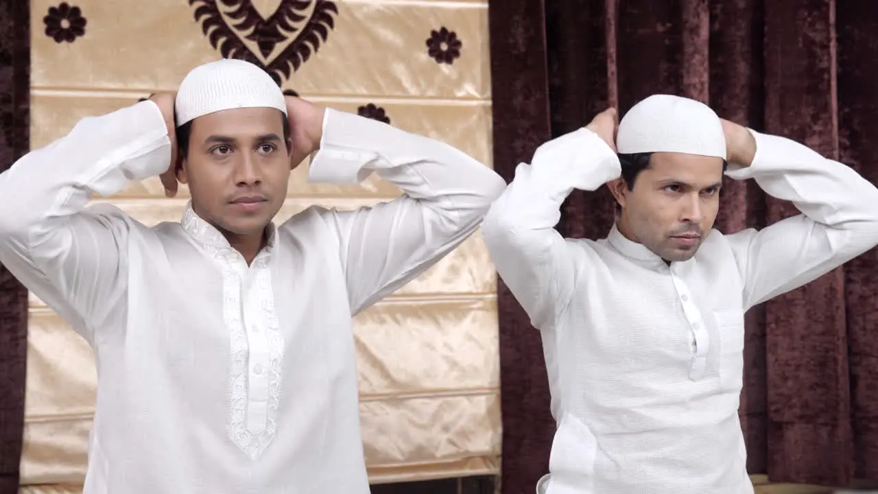 Muslim men performing rituals of Ramadan prayer