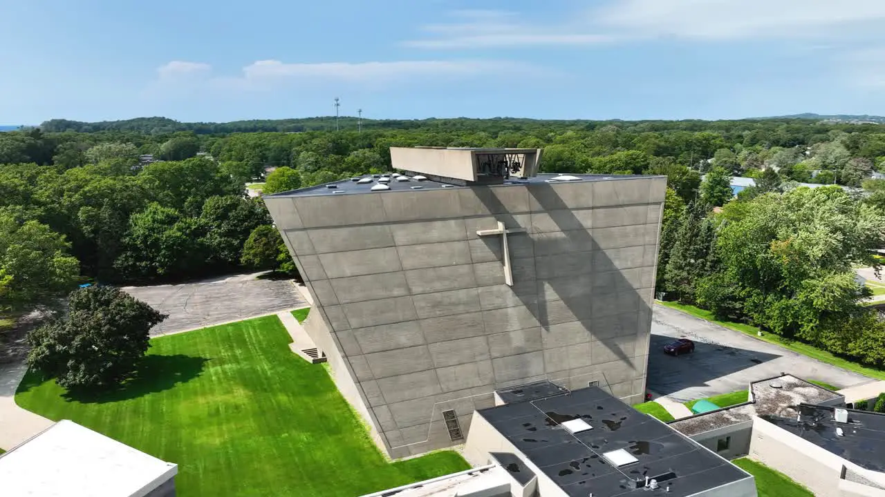 Brutalist church of stone slow high rotation to face it