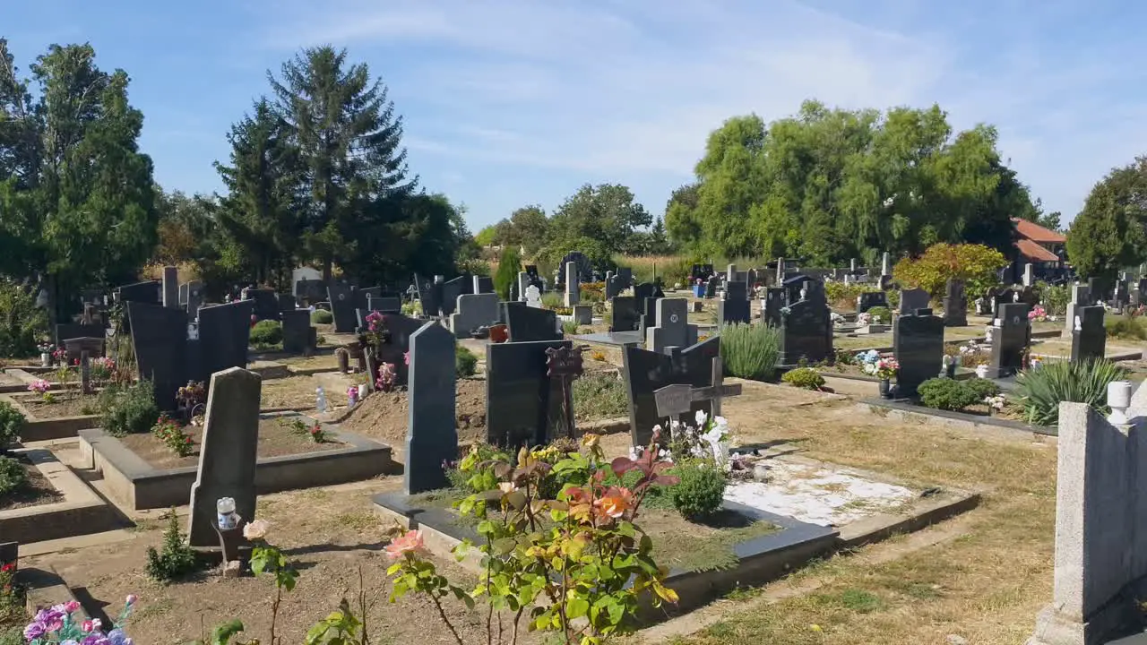 A sunny day at the cemetery with marble monuments