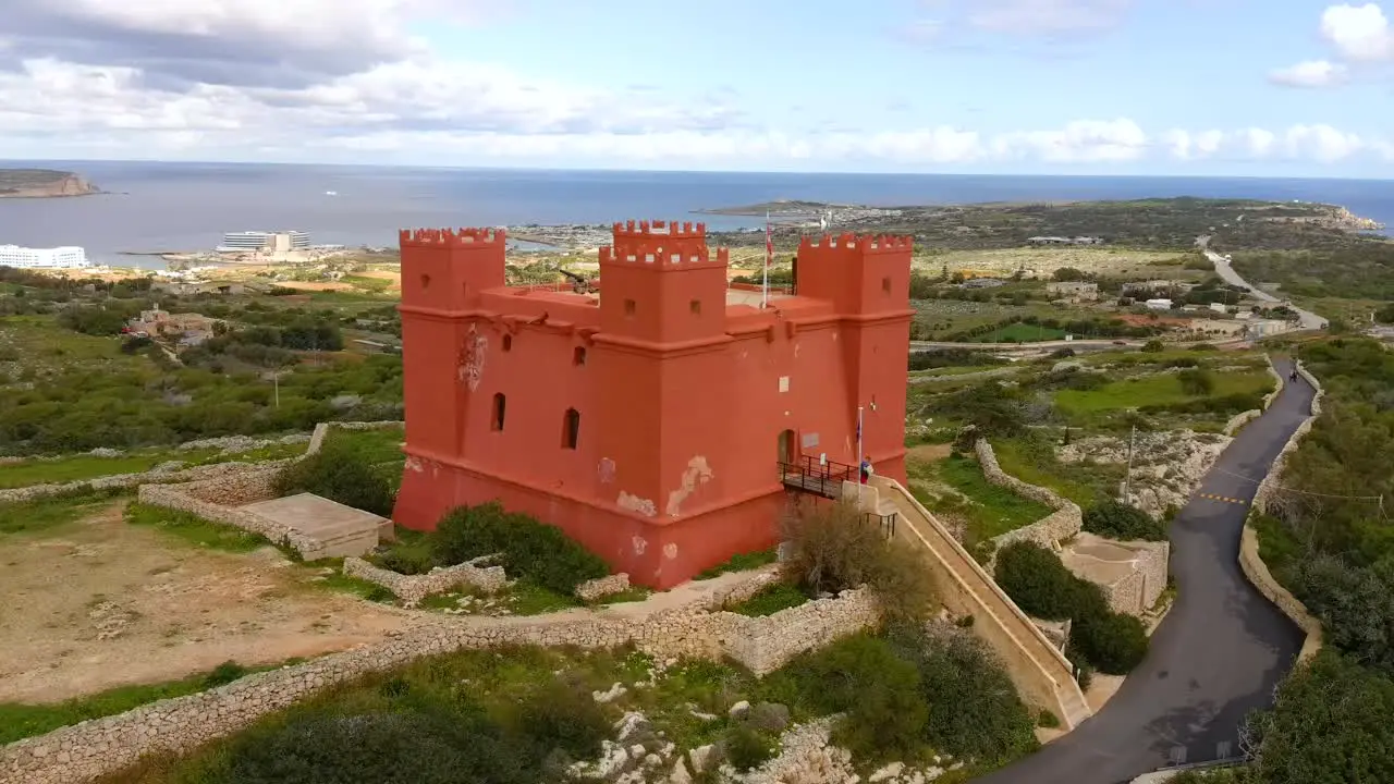 Drone shot orbiting Mellieha's Red Tower also know as St Agatha's Tower