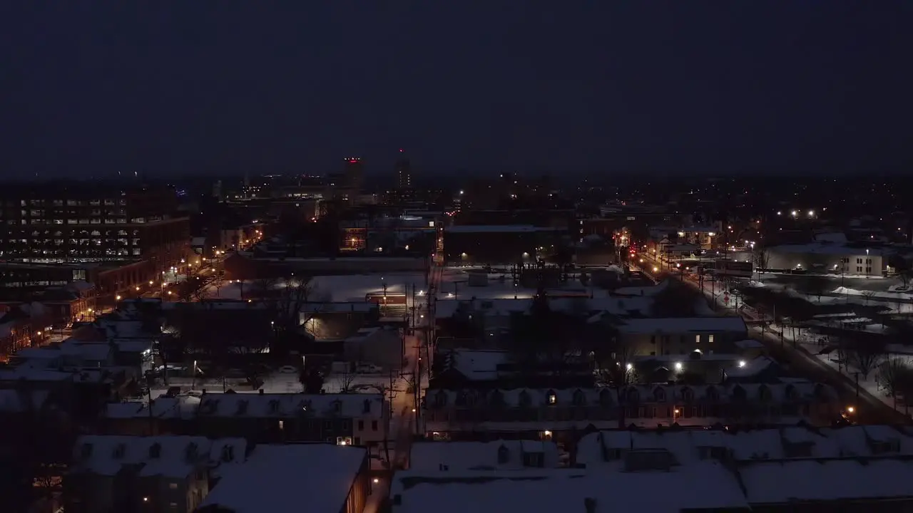 Rising aerial of urban city in USA during dark winter night