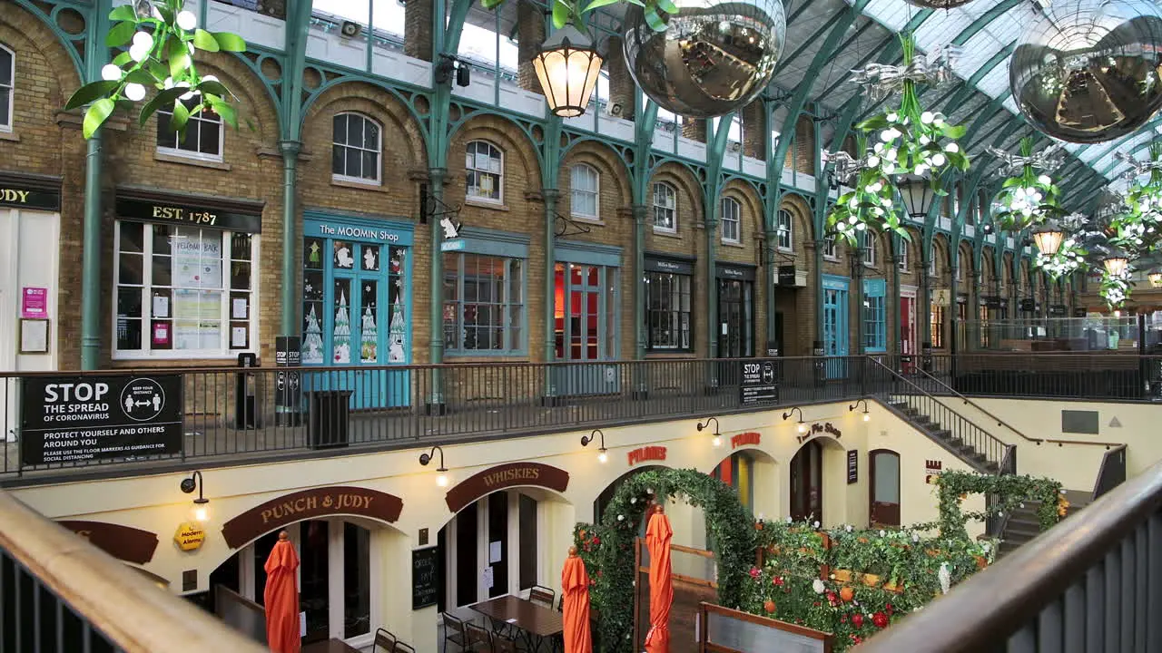 London in Coronavirus Covid-19 lockdown with empty streets quiet deserted roads no people and closed shops shut at Covent Garden market a popular tourist area during the pandemic in England Europe