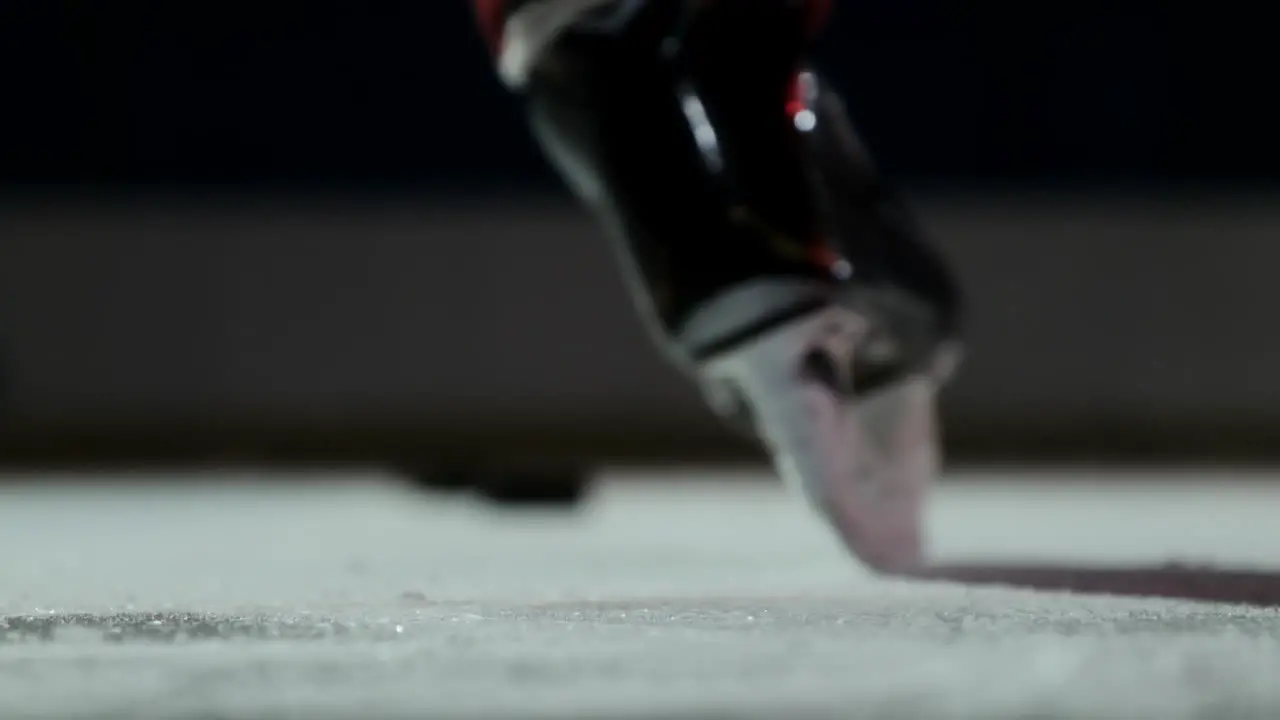 Close-up hockey player strikes the goal in slow motion