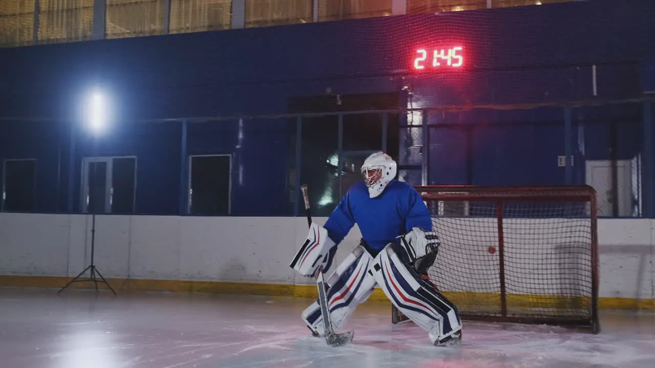 Professional hockey player attacks the gate and strikes but the goalkeeper beats the puck A goal in hockey Goal scored Bullet penetration