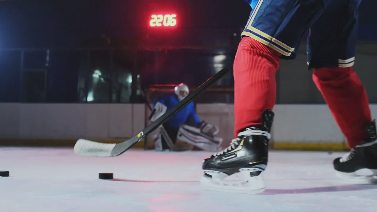 Close-up slow motion hockey puck kick and flying snow A spectacular blow