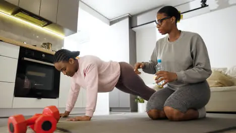 Women doing sports at home