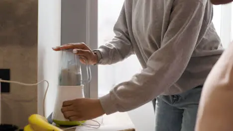 Women preparing smoothie