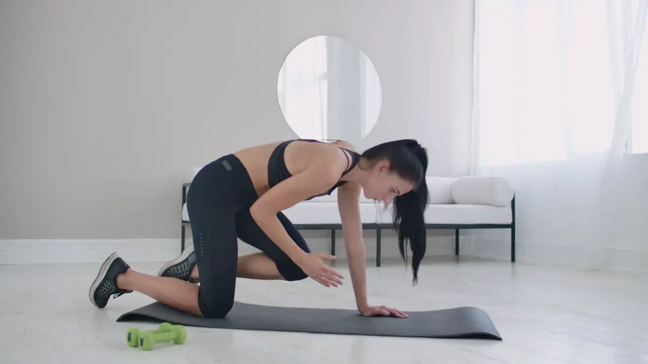 The demonstration of a young woman about how to do the exercise properly