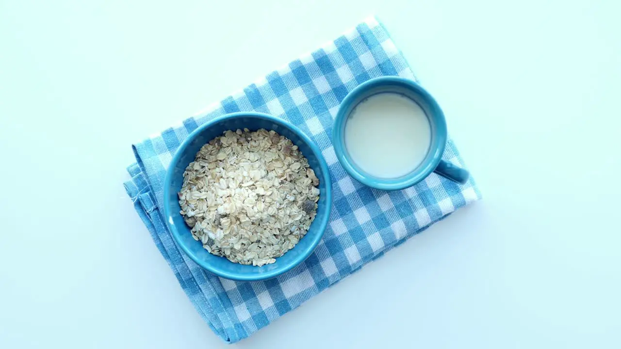 Cereal breakfast and glass of milk on table