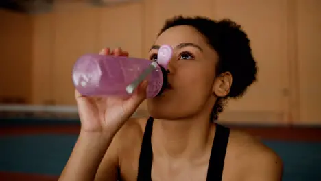 Happy woman drinking water