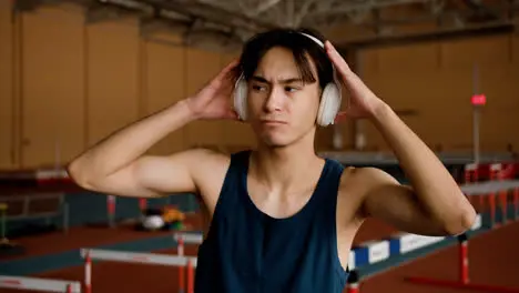 Young man dancing indoors