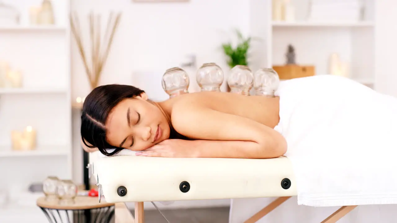 Relax cupping and woman at a spa for back pain