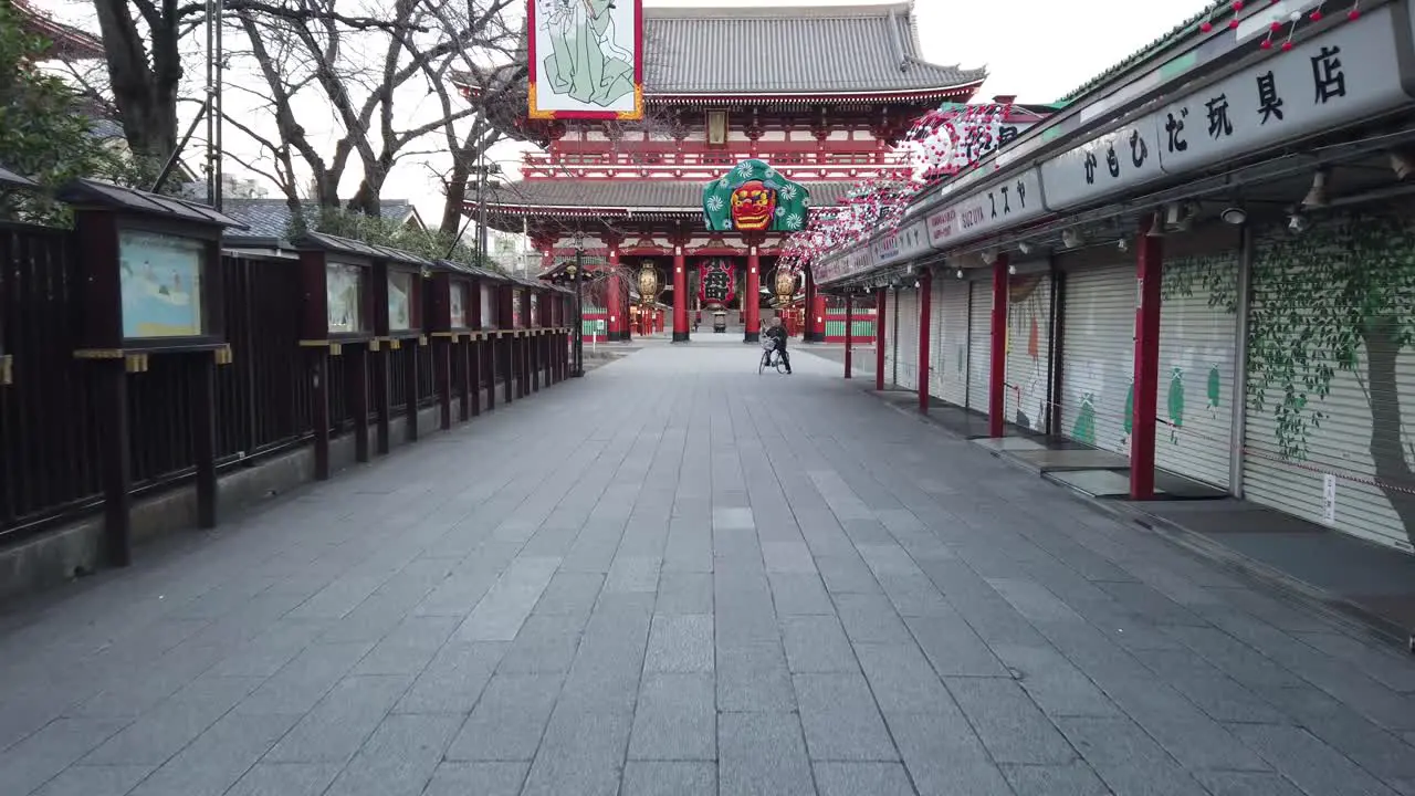 Tokyo Japan slowmotion pov moving into shopping street at the Sensoji japanese temple in Asakusa area in early morning