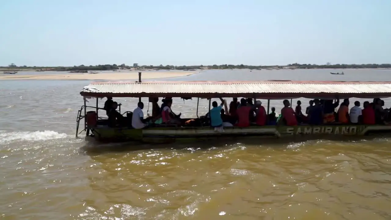 Water-taxi transports African people along the Tsiribihina River Madagascar