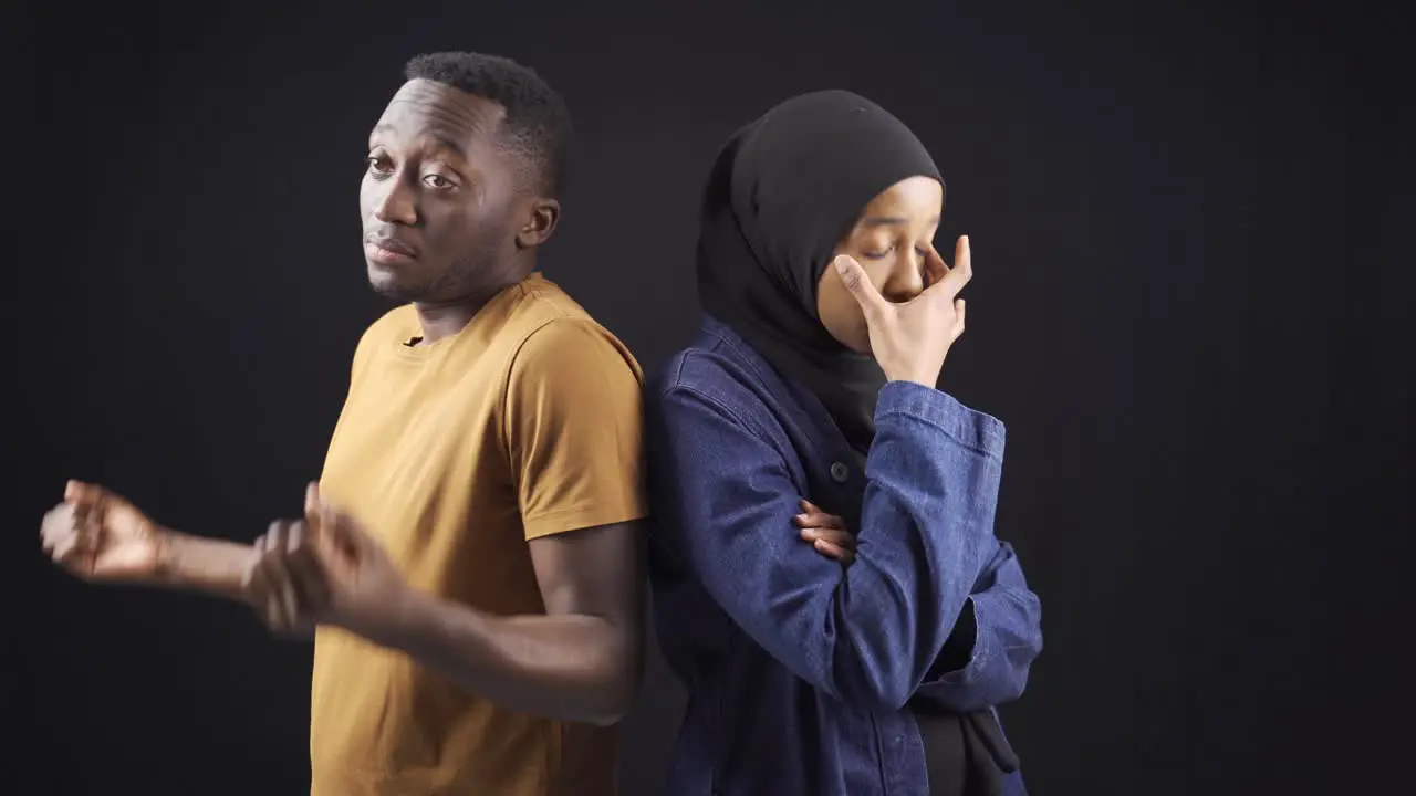 Muslim African couple are unhappy and overwhelmed in their marriage or relationship