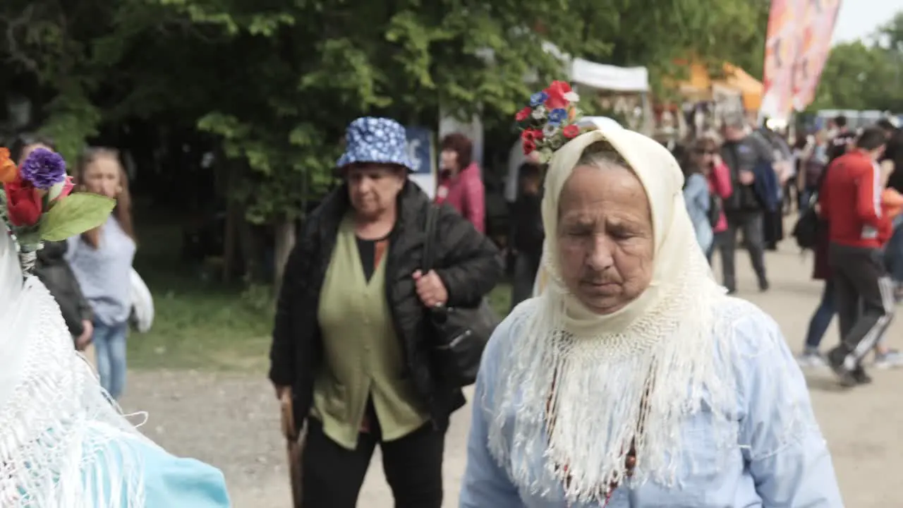 Group of ethnic old ladies dressed in traditional costume at festival