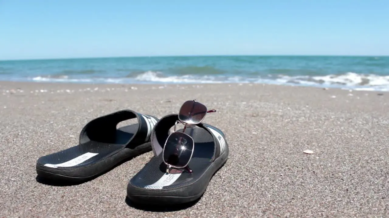 Slipper And Glasses In Sunyy Beach