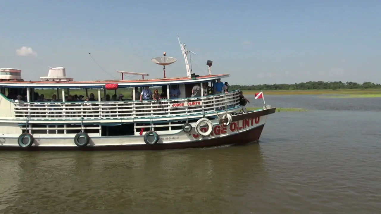 Brazil Amazon backwater near Santarem river boat passing s