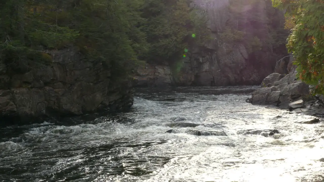 Beautiful river flowing through giant rock walls creating imposing natural walls