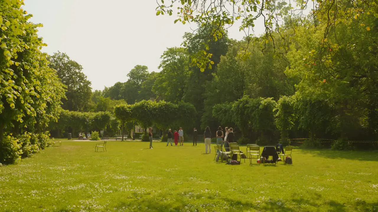 Group Of Students At The Green Lush Nature Landscape Of Minnewaterpark In Bruges Belgium