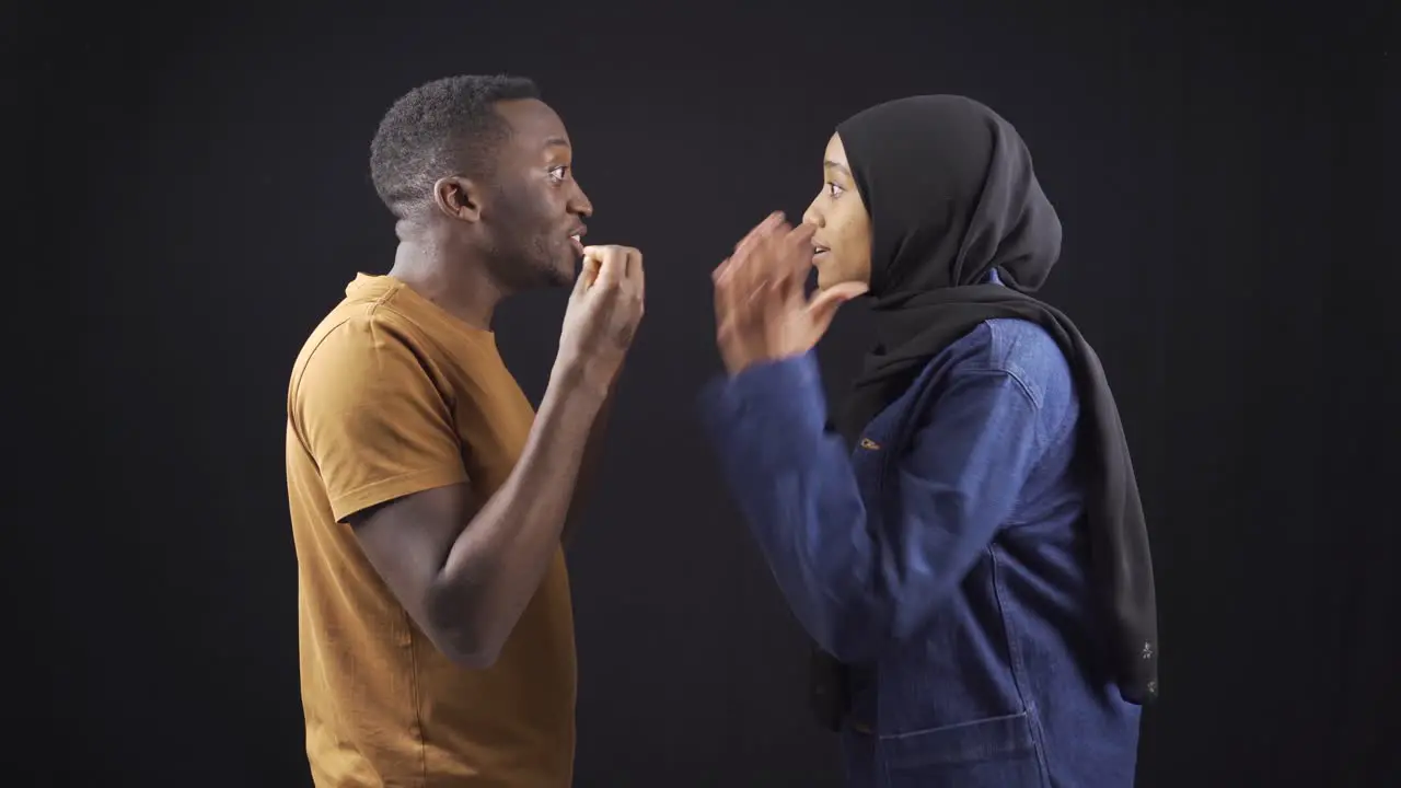 Unhappy muslim african couple arguing and not listening to each other