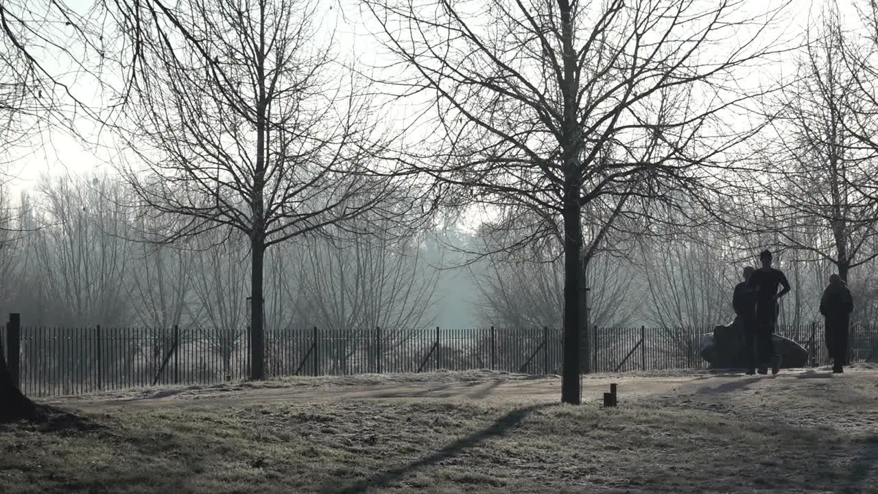 On a frosty morning dog walkers explore the grounds of Christ Church in Oxford UK 12