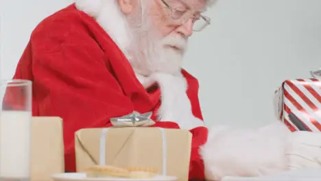 Medium Shot of Santa Writing at His Desk