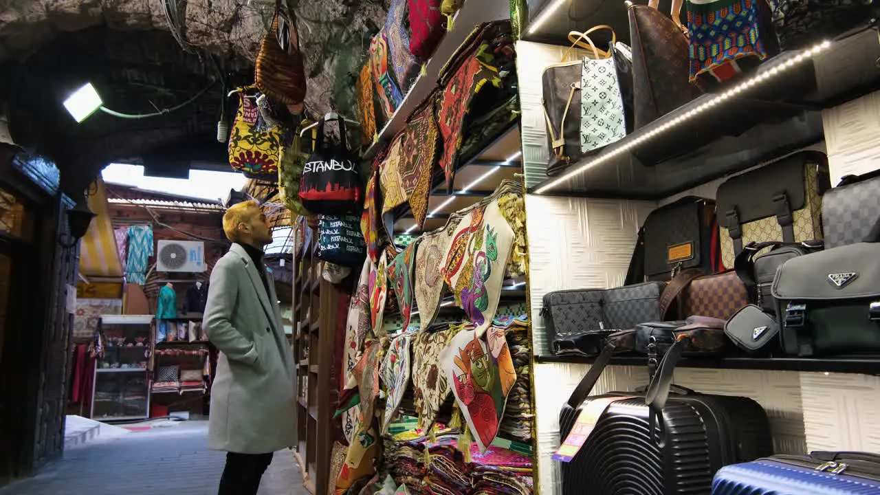 Wide Shot of Man Looking in Shop