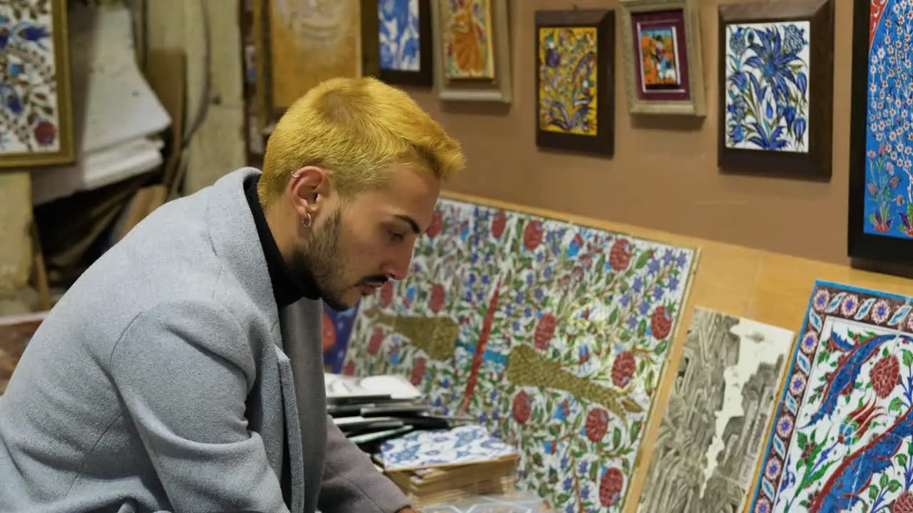 Mid Shot of Man Browsing Tiles