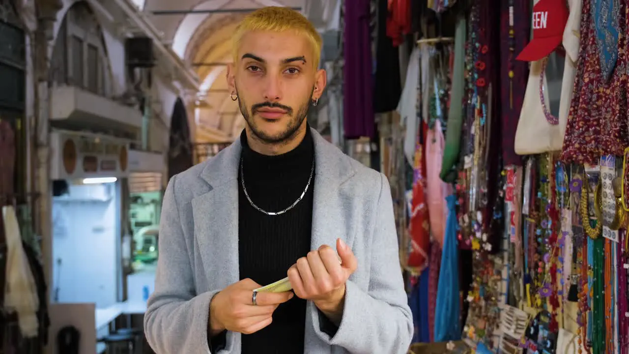 Mid Shot of a Man Counting His Money