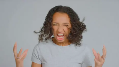 Portrait Shot of Young Adult Woman Looking Angry