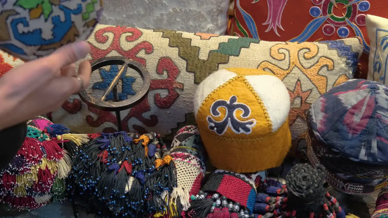 High Angle Shot of Man Looking at Hats