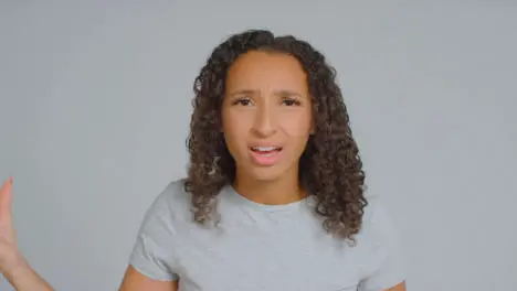 Portrait Shot of Angry Adult Woman Shouting to Camera